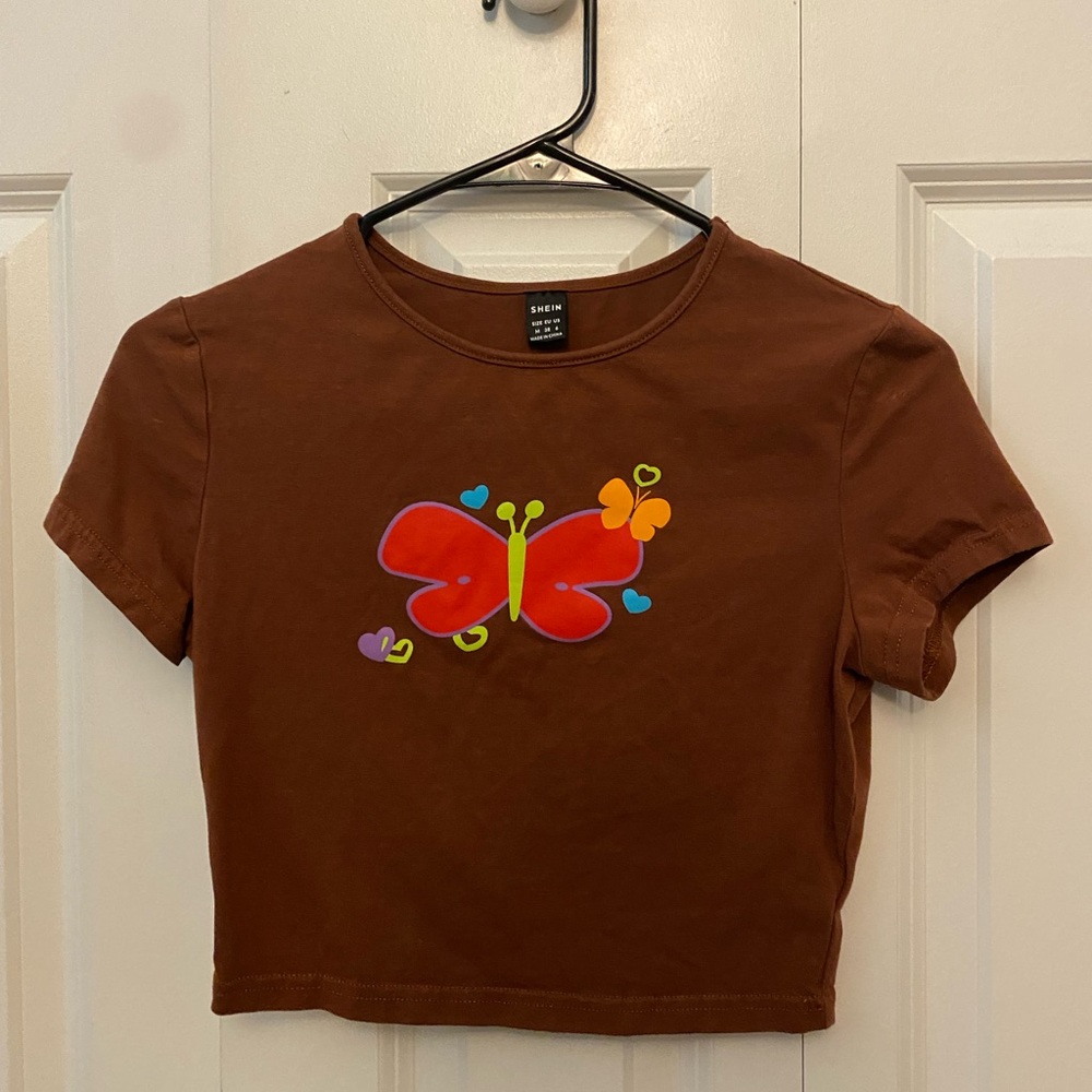 Selling this cute little brown crop top with a butterfly on it!